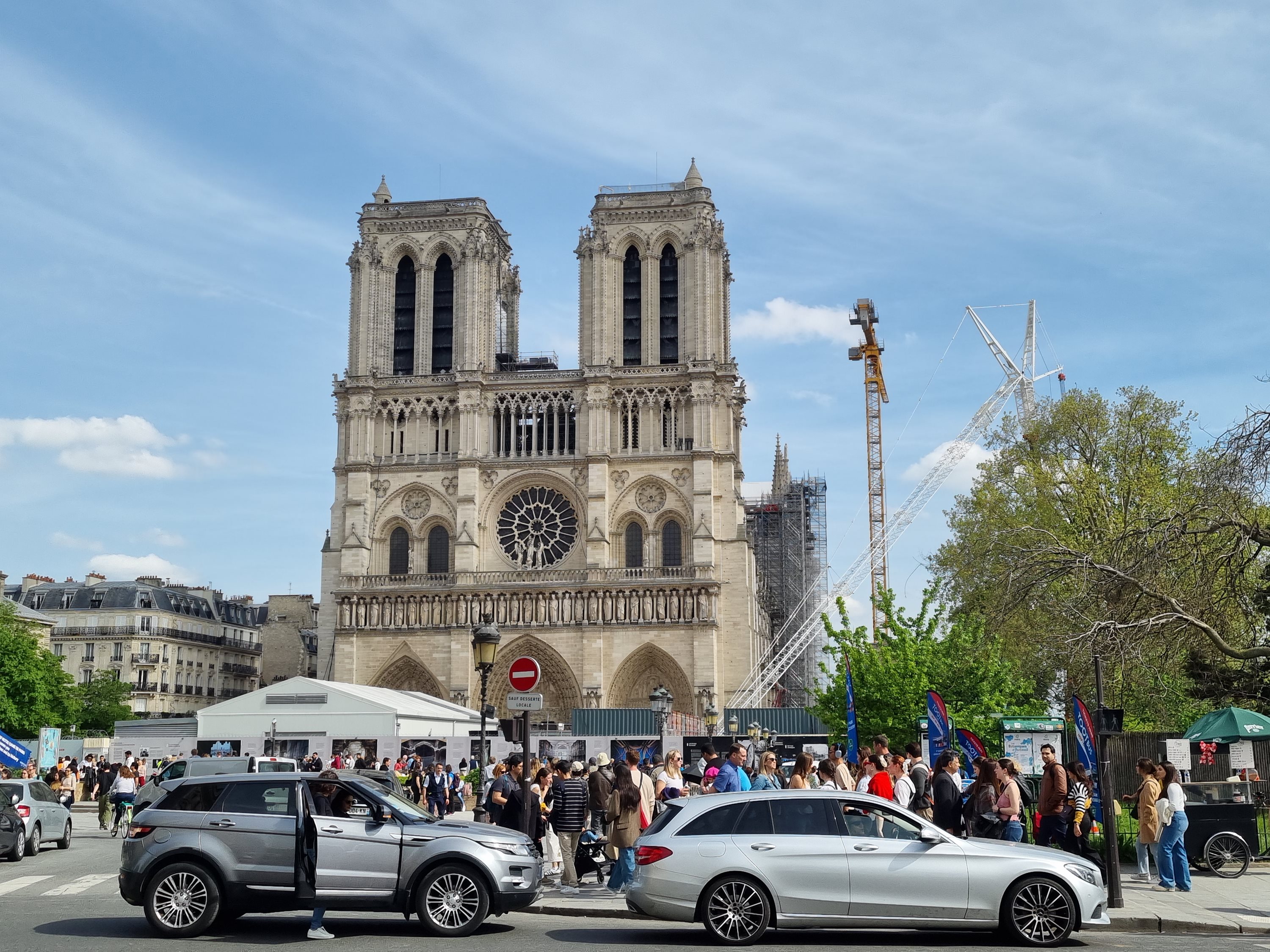 Crowds gather outside Notre-Dame cathedral in Paris