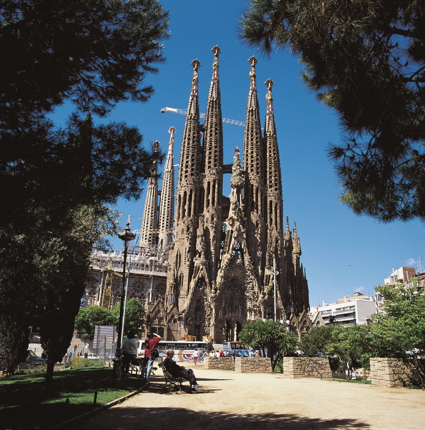 Sagrada Família basilica towers rising above a park in Barcelona
