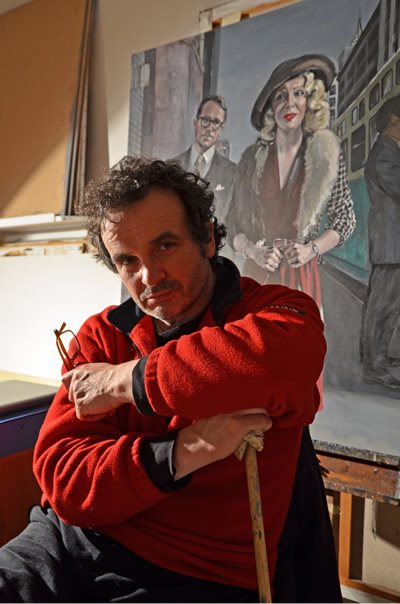 A portrait of a painter in a red jumper
