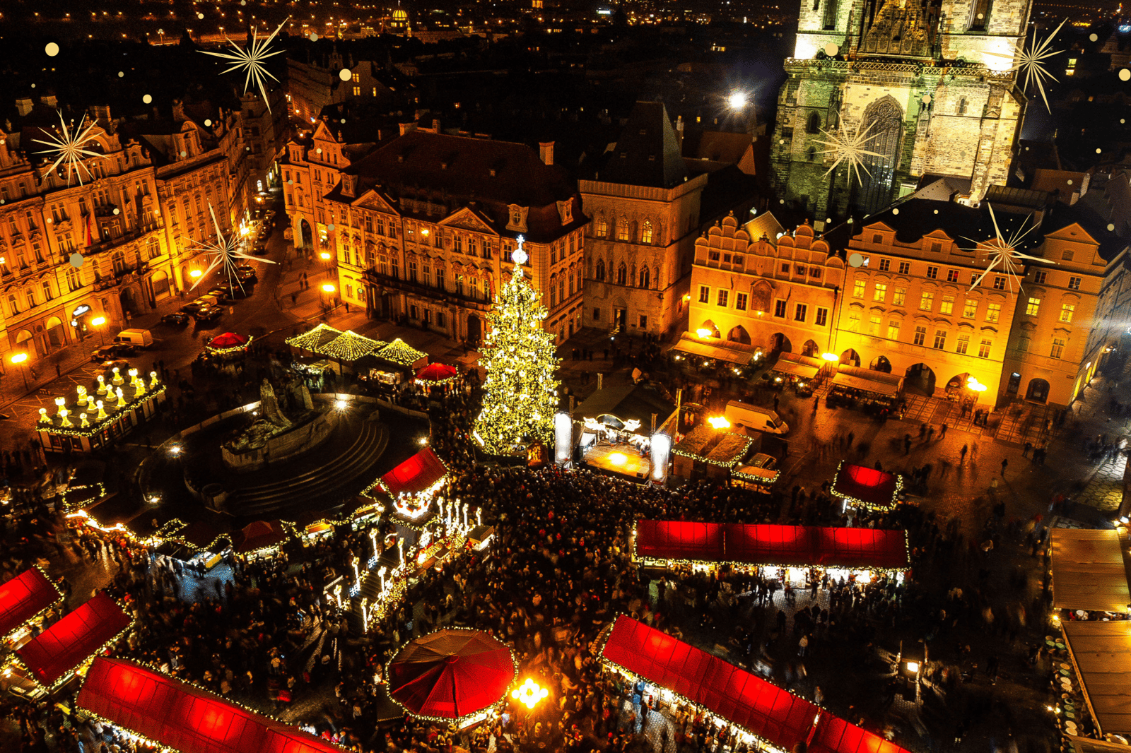 Old Town Square in Prague lit up at night for the Christmas market