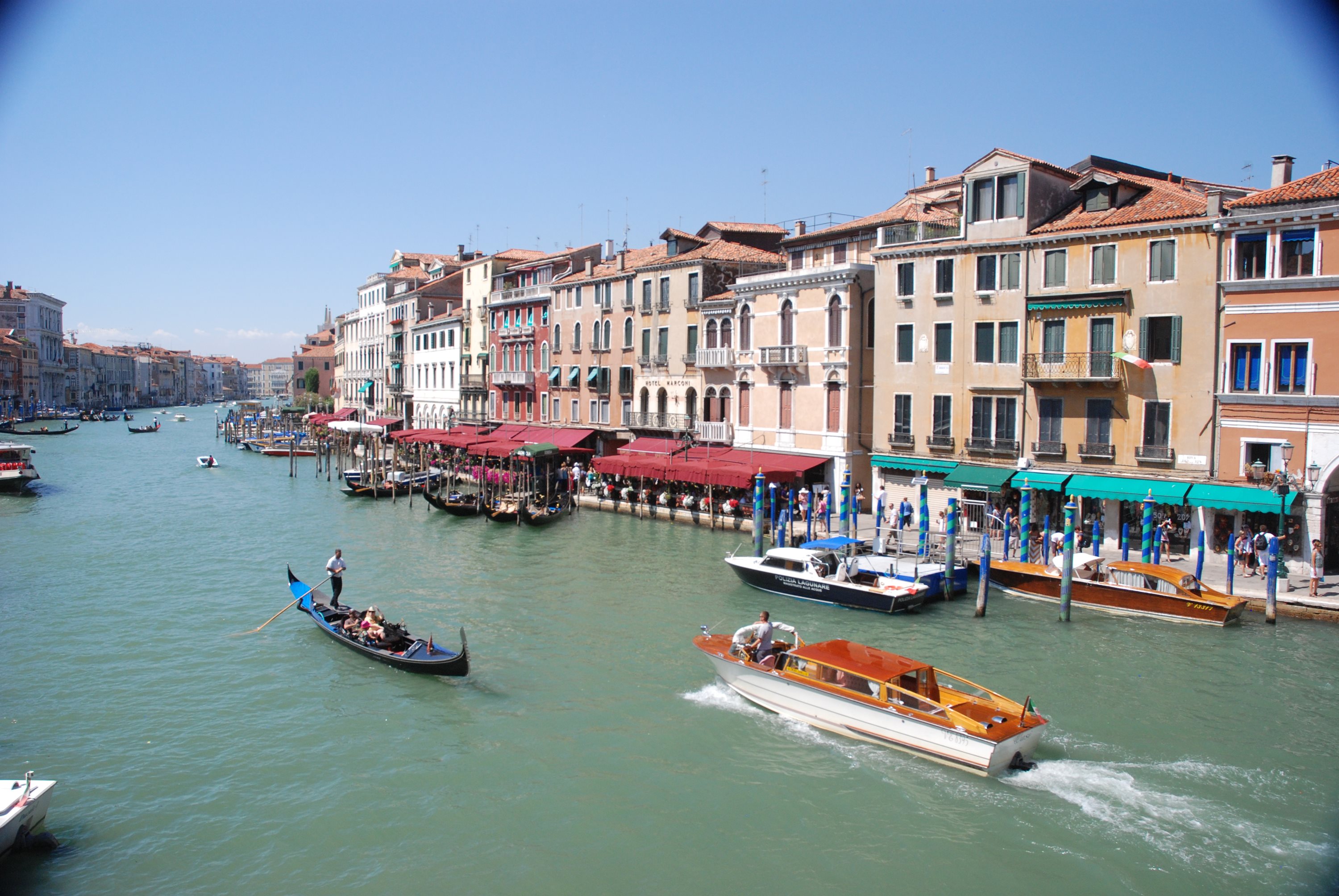Gondola and water taxis on Venice's Grand Canal lined with buildings